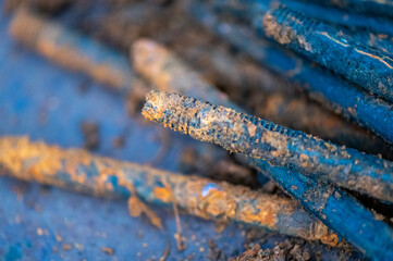 metal stud, fasteOld metal studs covered in rust, close-up, selective focus.ning part, rust