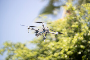 a drone flying high and the sky