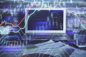 Double exposure of forex chart and work space with computer. Concept of international online trading.