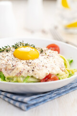 Carbonara sauce. Fried ham in heavy cream and with raw egg yolk and cherry tomatoes. Carbonara pasta made with fresh zucchini noodles.