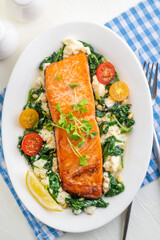 Grilled salmon steak with vegetables and fresh microgreens. Food concept for a ketogenic and no carbohydrate diet.