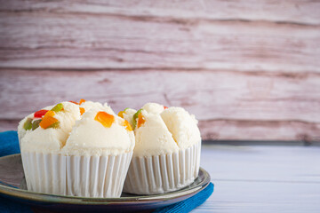 Thai Rice flour muffin topped with dry fruit on plate
