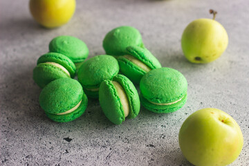 Macaroons. Delicious french desserts. Macaroons on the table. Macaroons with cream cheese and apples