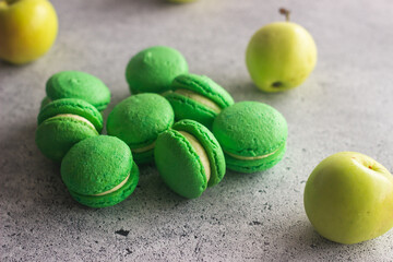 Macaroons. Delicious french desserts. Macaroons on the table. Macaroons with cream cheese and apples
