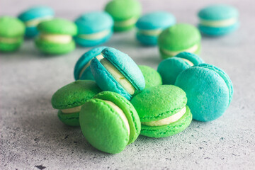 Macaroons. Delicious french desserts. Macaroons on the table. Macaroons with cream cheese and apples