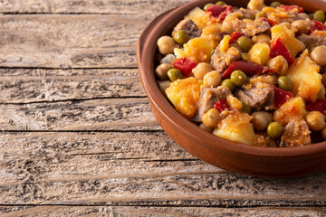 Ropa vieja food in bowl on wooden table. Copy space	