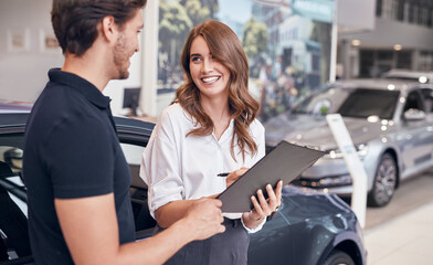 Cheerful female dealer talking with client