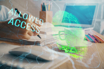 Blue fingerprint hologram over hands taking notes background. Concept of security. Double exposure