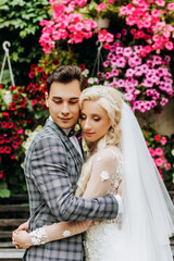 Portrait of newlyweds leaning against each other's faces.