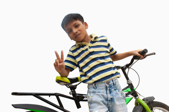 Portrait of confident boy With bicycle