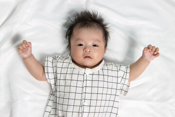 Portraiture image of Three month old Asian Cute little baby boy lsolated on white background