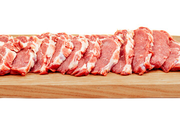 Fresh raw  beef steak on a wooden cutting board close-up isolated on a white background.