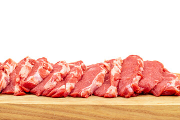 Fresh raw  beef steak on a wooden cutting board close-up isolated on a white background.