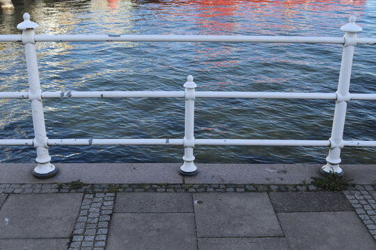 Metal railings by the sea