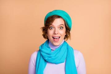 Close-up portrait of her she nice-looking attractive lovely winsome pretty charming cute cheerful cheery amazed funny girl wearing beret isolated over beige pastel color background