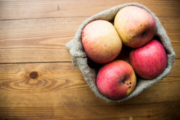 ripe apples on a wooden background