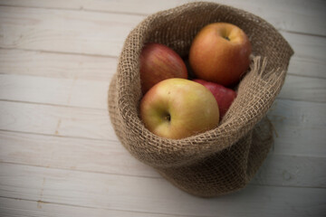 ripe apples on a wooden background