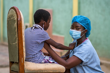 Closeup shot of a boy and a doctor wearing sanitary mask