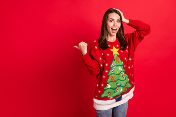 Portrait of her she nice-looking attractive pretty amazed cheerful cheery girl demonstrating newyear copy space wow cool offer winter isolated bright vivid shine vibrant red color background