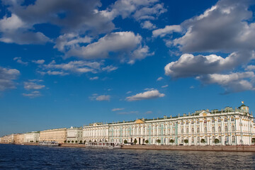 Fototapeta na wymiar Hermitage Museum and blue sky with clouds viewing from a sightseeing cruise, St Petersburg, Russia. June 14, 2018.