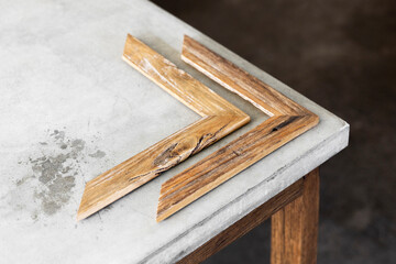 Natural recycled timber picture frame sample angles on display on concrete surface.