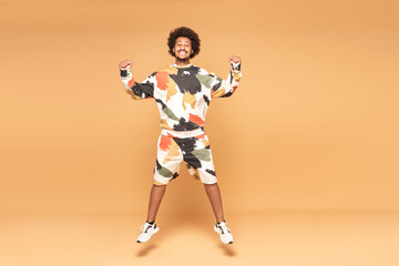 Young Afro Man Having Fun Jumping