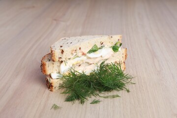 Healthy and tasty sandwich on a wooden background.
