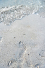 Foot print on sand at beach.Thailand.