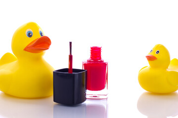 nail polish with toy on white background