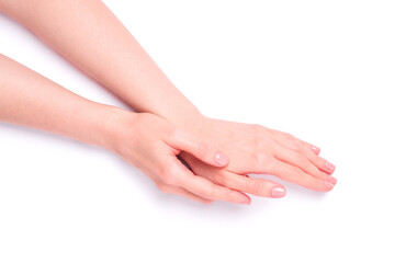 Beautiful female hands showing fresh cute pink manicure, skin and nail care concept, isolated