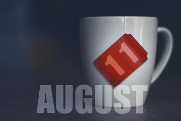 august 11th. Day 11 of month,Tea Cup with date on label from tea bag. summer month, day of the year concept