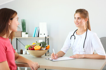 doctor nutritionist takes a patient in the office. proper nutrition, weight control