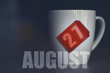 august 27th. Day 27 of month,Tea Cup with date on label from tea bag. summer month, day of the year concept