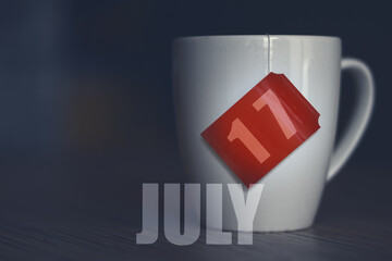 july 17th. Day 17 of month,Tea Cup with date on label from tea bag. summer month, day of the year concept