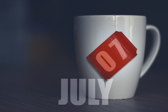 July 7th. Day 7 Of Month,Tea Cup With Date On Label From Tea Bag. Summer Month, Day Of The Year Concept