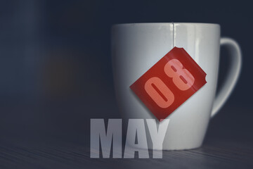 may 8th. Day 8 of month,Tea Cup with date on label from tea bag. spring month, day of the year concept
