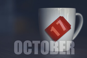 october 17th. Day 17 of month,Tea Cup with date on label from tea bag. autumn month, day of the...