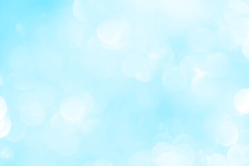 Bokeh light on blue background, sky with circle glitter light blue. Snow abstract soft glowing with vivid bright light and bokeh blur effect. 