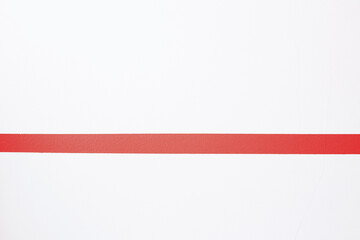 Obraz premium Red paint stripe on a white wall, minimalism