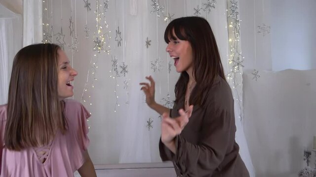Twi Girls Dancing And Jumping On Bed With Blinking Background , Christmas