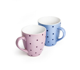Two dotted tea cups on white background