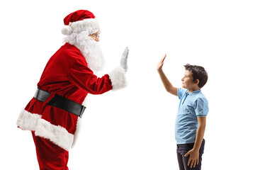 Santa gesturing high-five with a boy