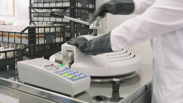 Scientist working with modern machine in lab