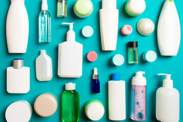 Group of plastic bodycare bottle Flat lay composition with cosmetic products on colored background empty space for you design. Set of White Cosmetic containers, top view with copy space