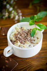 sweet noodles with milk and grated chocolate in a bowl