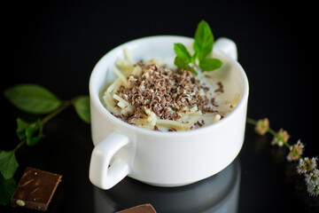 sweet noodles with milk and grated chocolate in a bowl