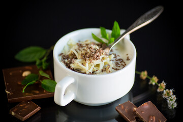 sweet noodles with milk and grated chocolate in a bowl