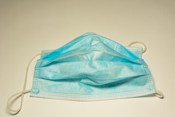 Worn out surgical mask blue colour, top view