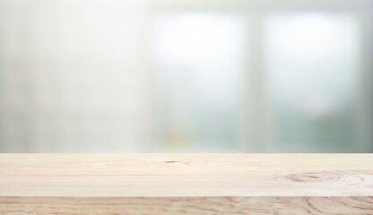 Wood table top on white wall glass  background.