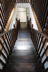 Dark brown Vintage wooden down stair perspective